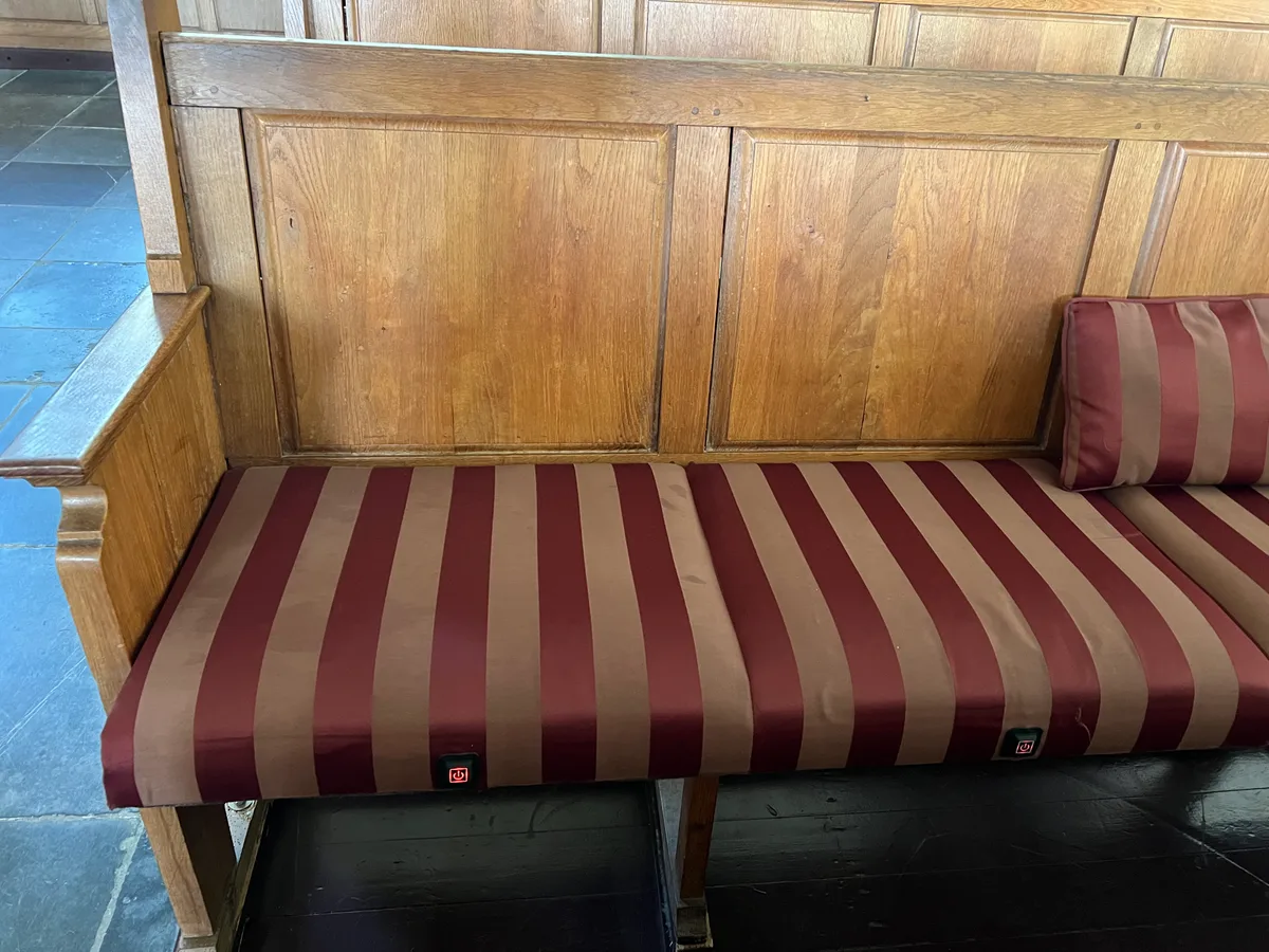 Detail of the control button sewn into a heated church bench cushion