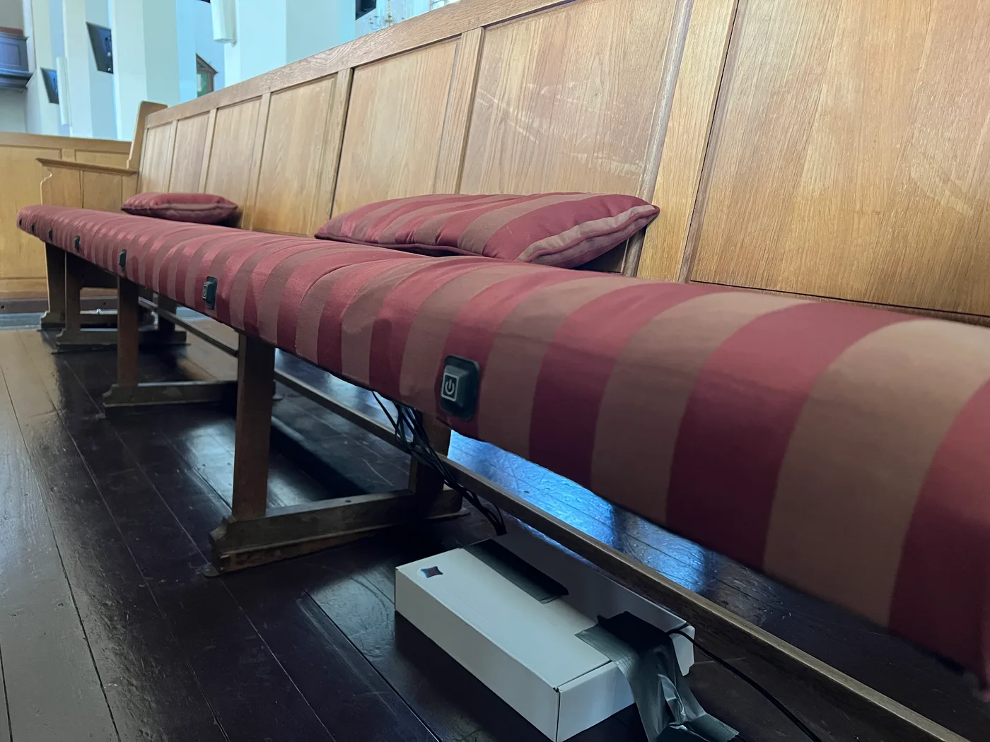 Heated church bench cushion with front control buttons