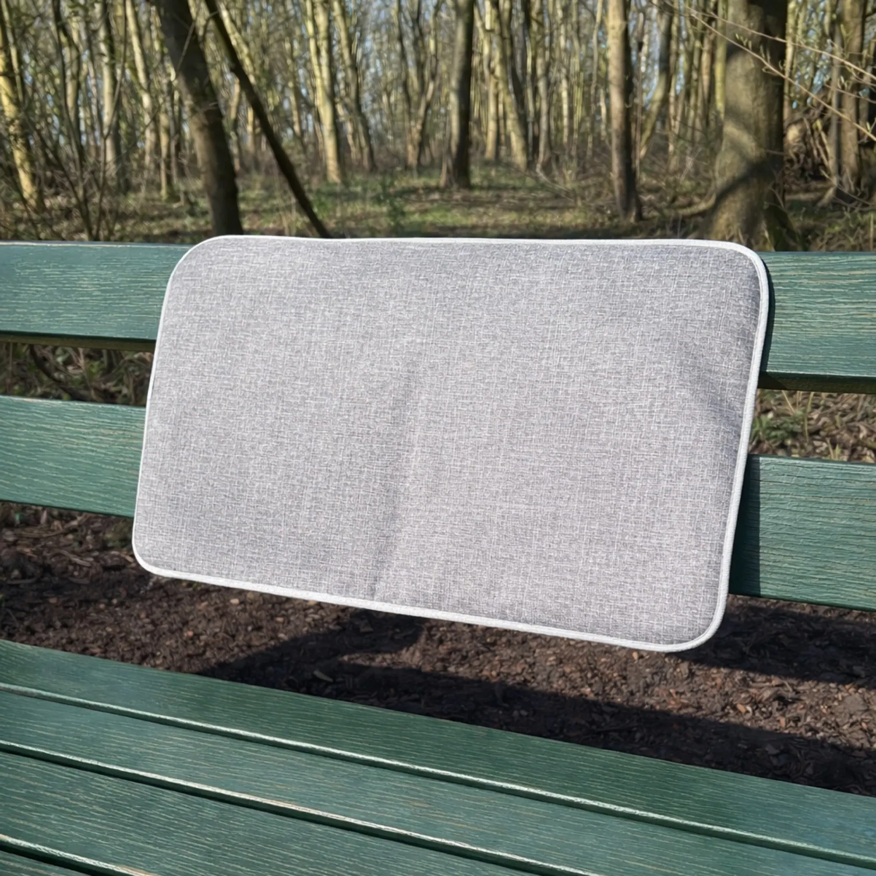 Warmpi Heatpad on an outdoor bench for personal warmth
